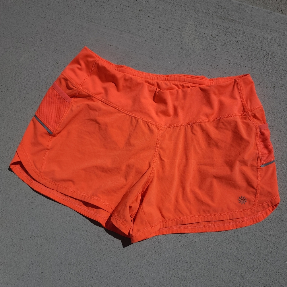 ATHLETA Neon Orange Lined Shorts Running Athletic Women Size Medium 3 Pockets